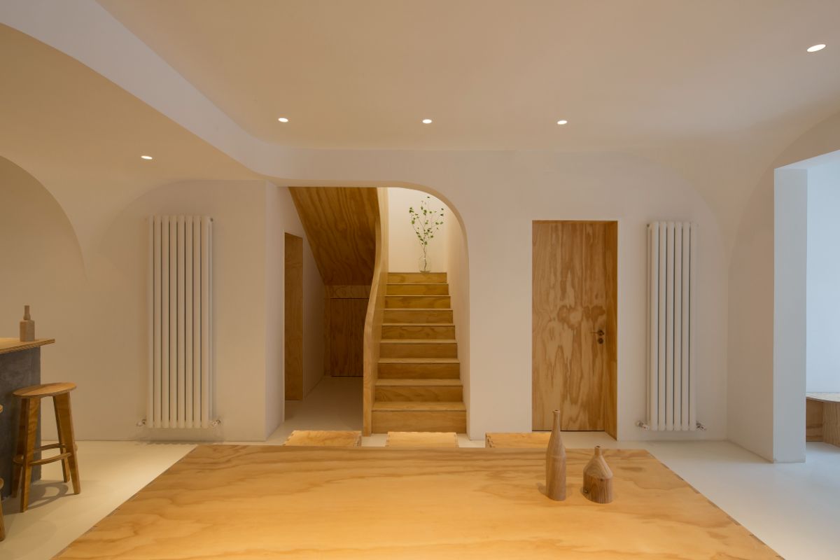 A view of the hard wooden stairs from the common living area.