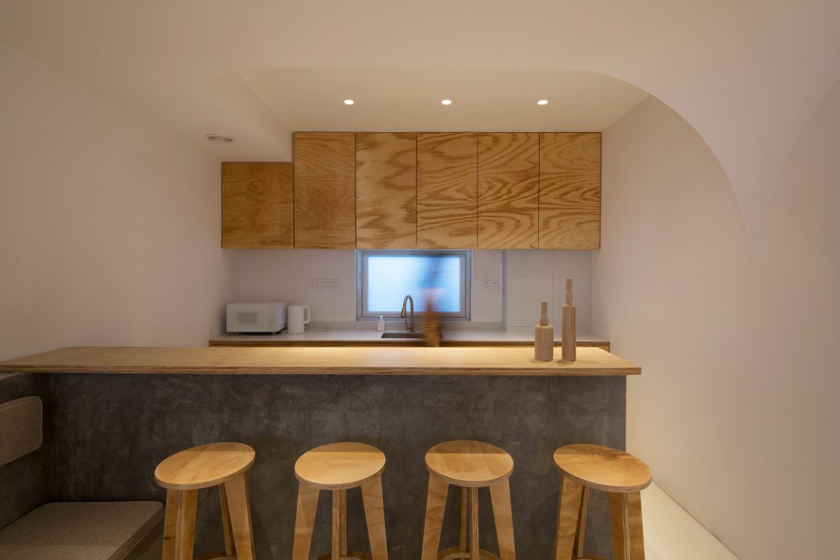 Concrete and hardwood design and furniture inspired the kitchen area.