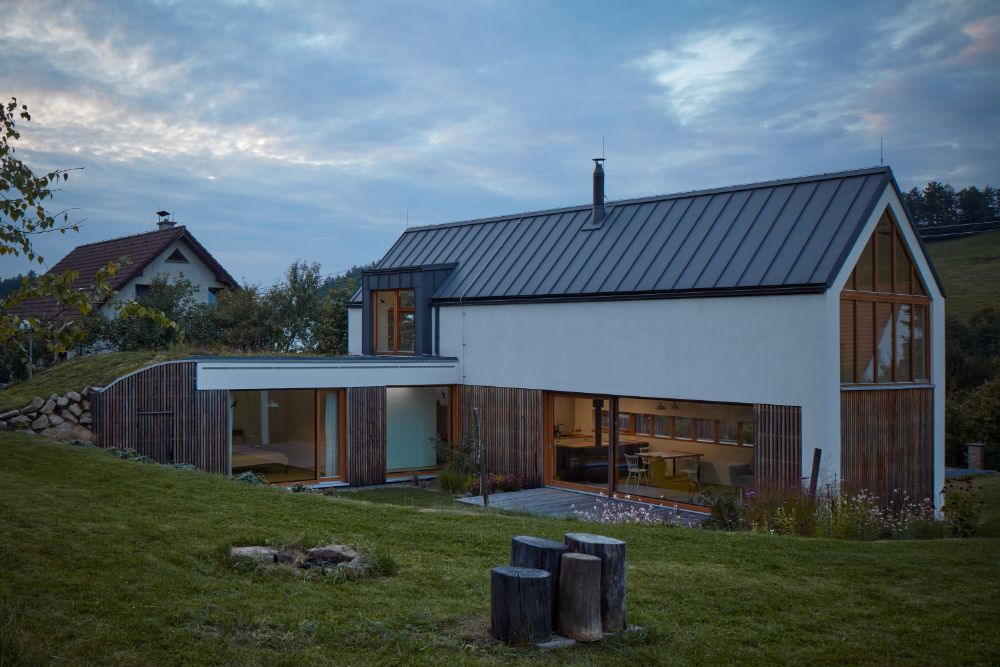 The outside left wing view of the house with a view to living area and bedroom.