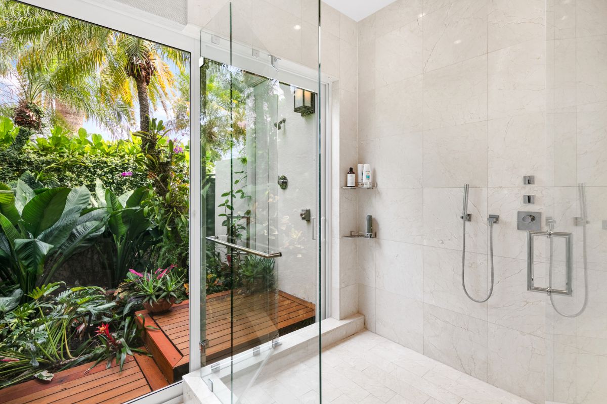 Master bathroom glass-enclosed shower area.