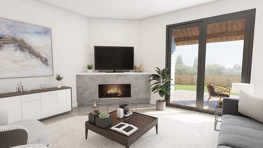 A corner fireplace topped with a TV warms the living room.