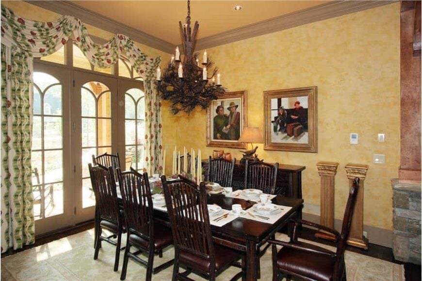 The formal dining room offers an 8-seater dining set, a matching buffet table, and front porch access via a glazed door.