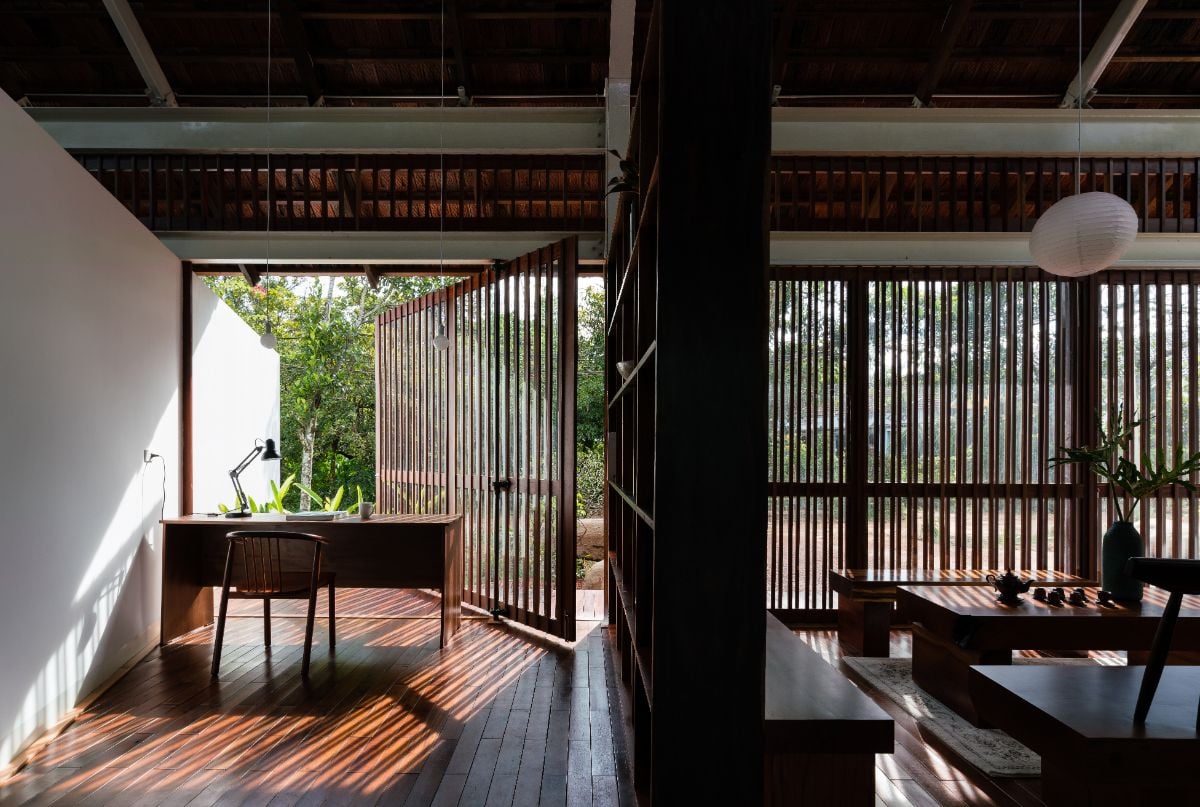 A private office that features double walls combined with the floor, the roof and the sliding doors.