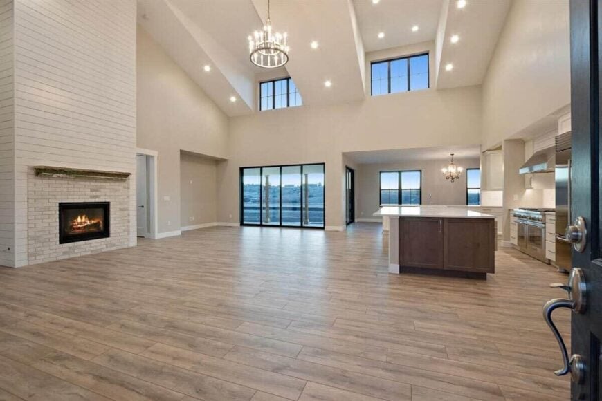 A spacious open floor plan combining the great room, dining area, and kitchen.