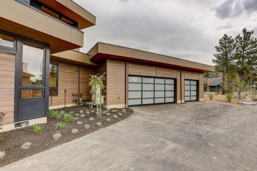 A closer look at the angled 3-car garage complemented with a concrete driveway.