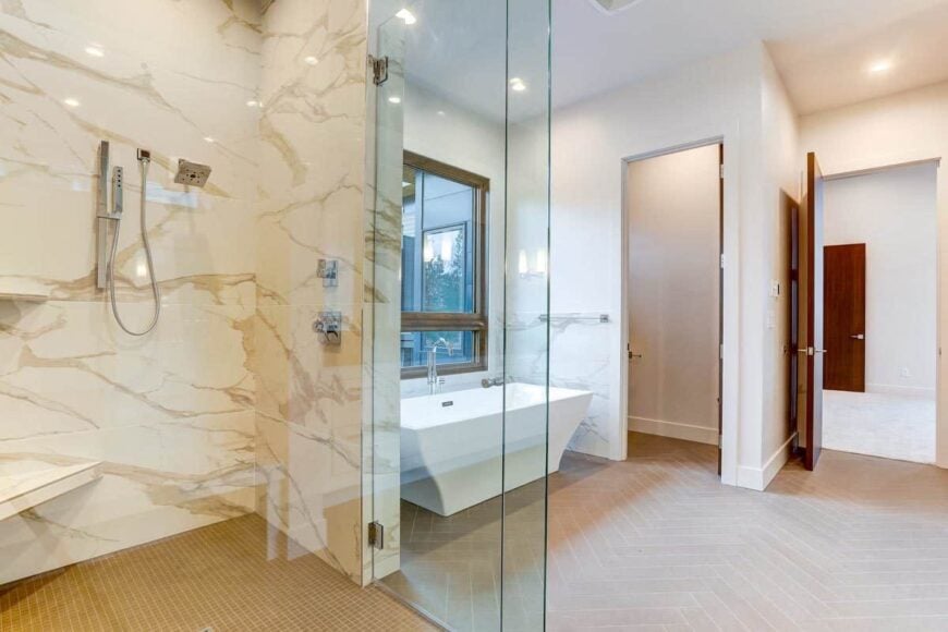 The primary bathroom includes a toilet room situated next to the bathtub.