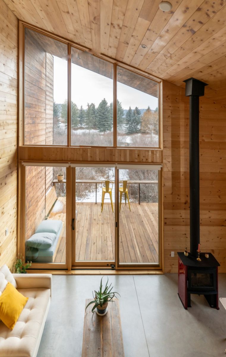 The double height living space that inspired from Nordic style with freestanding fireplace.