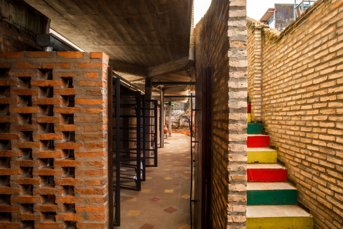 The boundary between the first and brightly colored stairs.