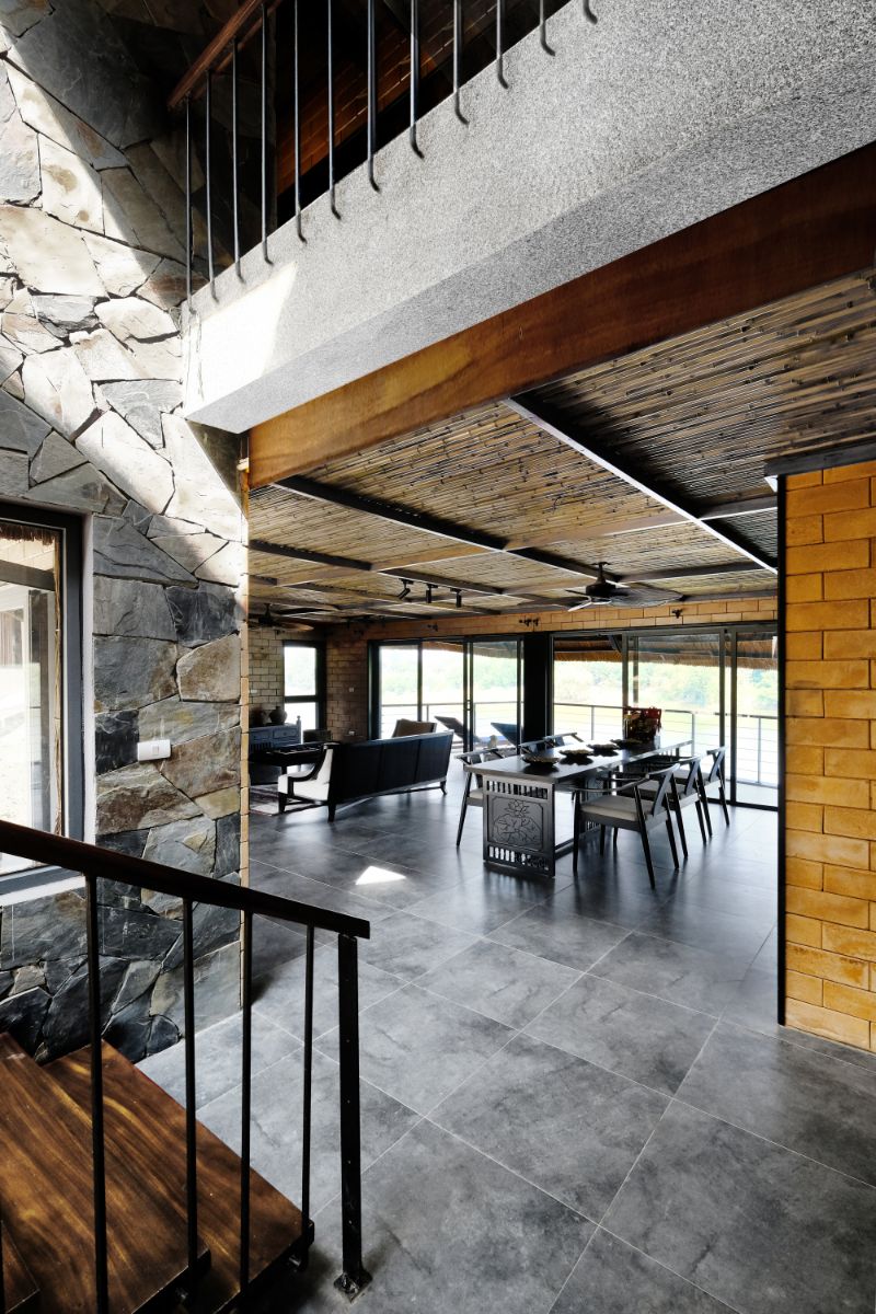 A view of the kitchen from the stairs with tile flooring.