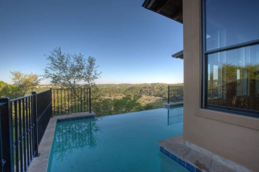 Pool terrace with infinity pool and stunning views of the surrounding landscape.