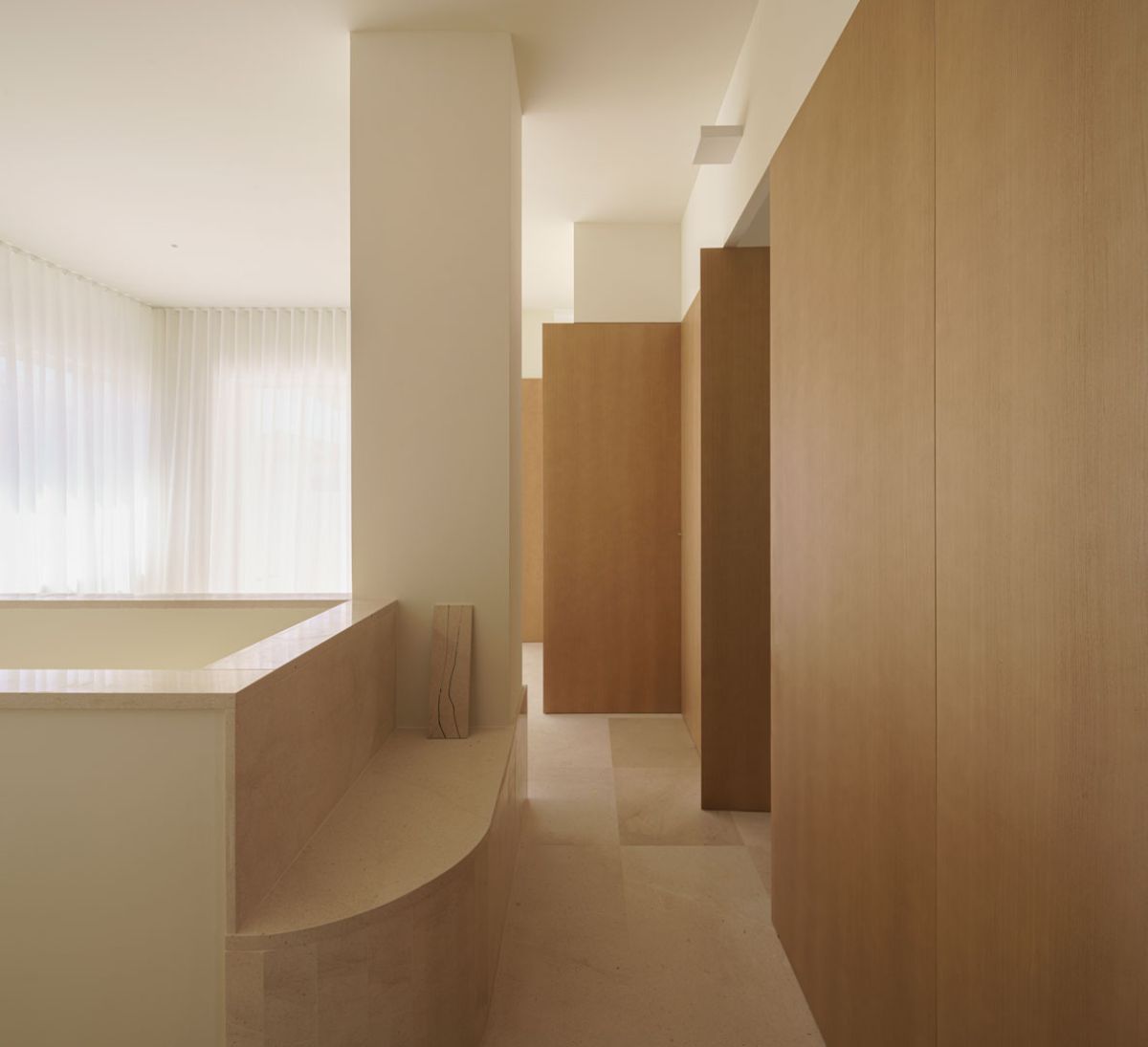 The primary dresser area that features a wooden closets.