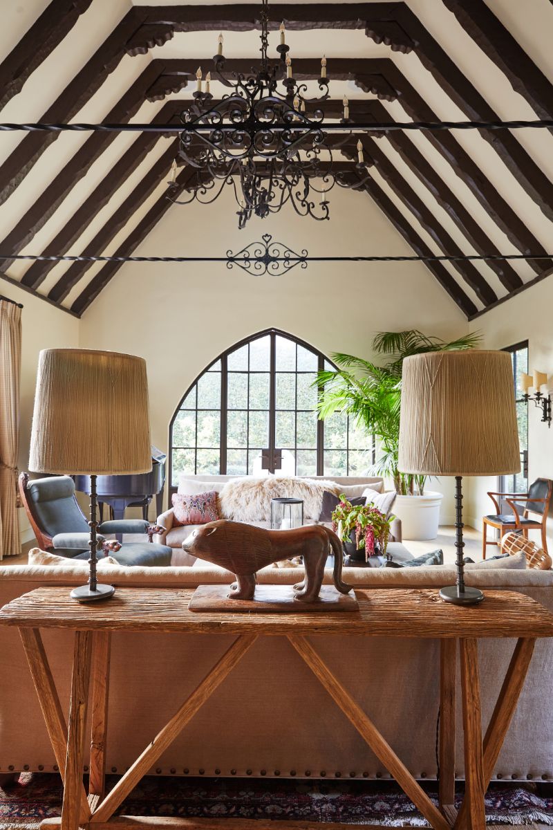 A living space with vaulted-ceilings and arc windows and doors. Image courtesy of Toptenrealestatedeals.com