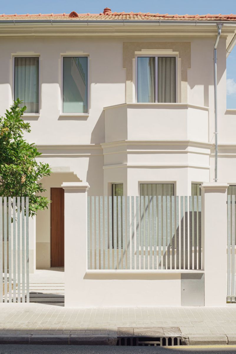 A closed view of a semi-detached house.