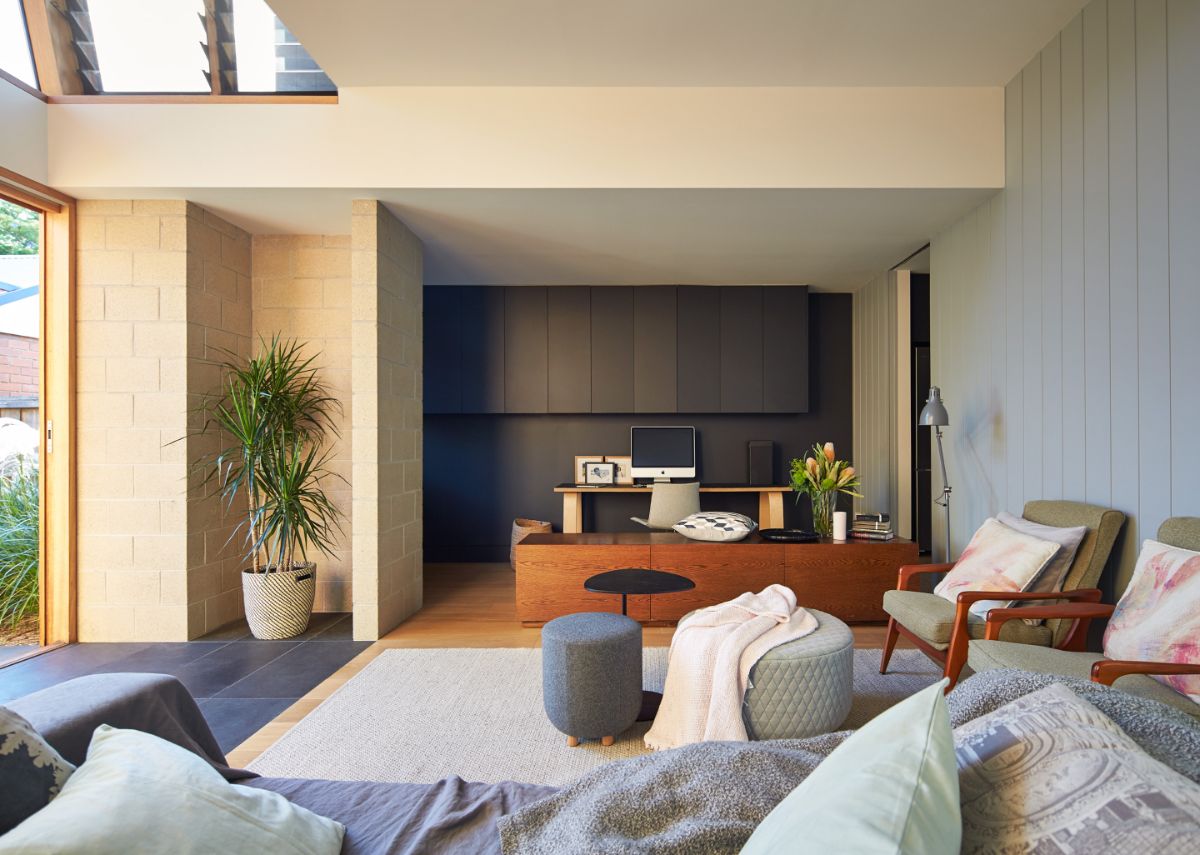 The downstairs living room deftly divided includes a sitting and a study area.
