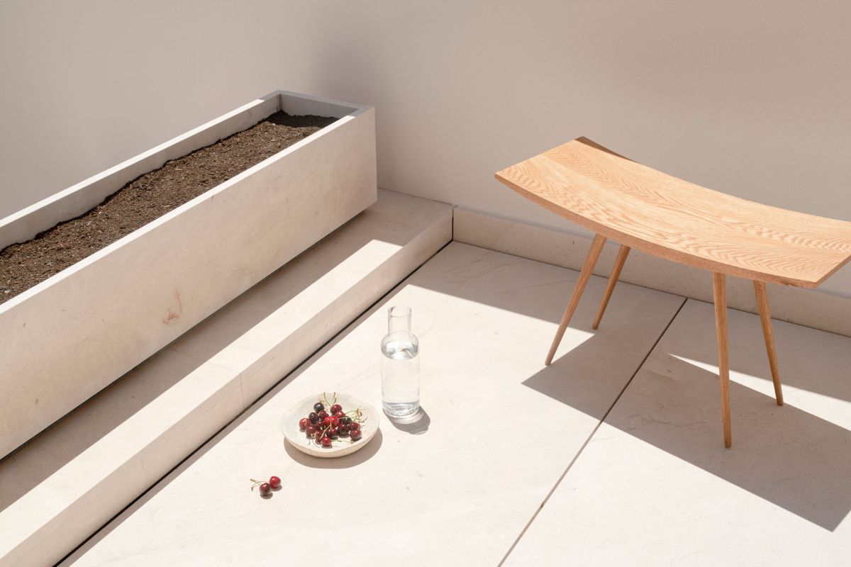 An outside living space closed to plant box.