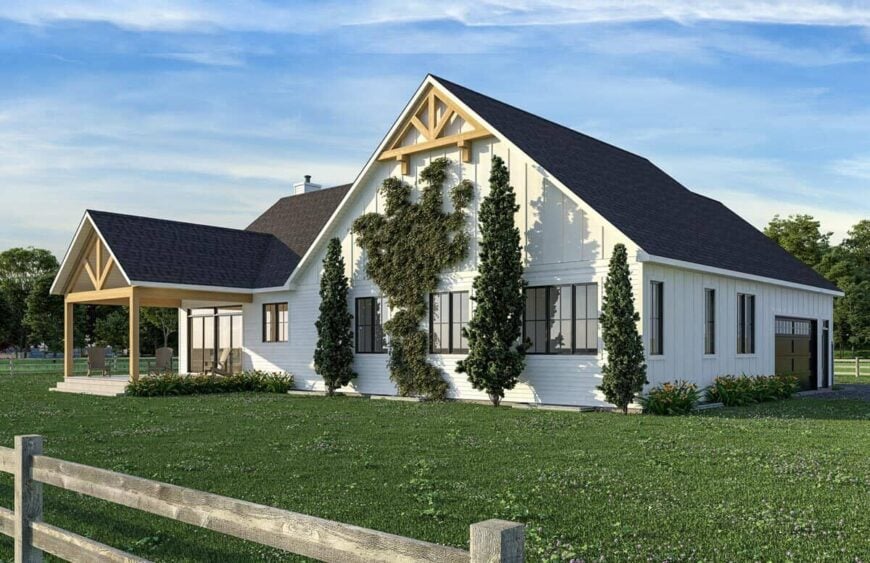Angled rear view showcasing its covered porch and gable rooflines adorned with wooden trims.