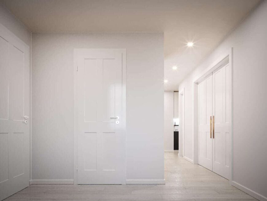 White walls and light hardwood floor creates a clean, cohesive look in the foyer.