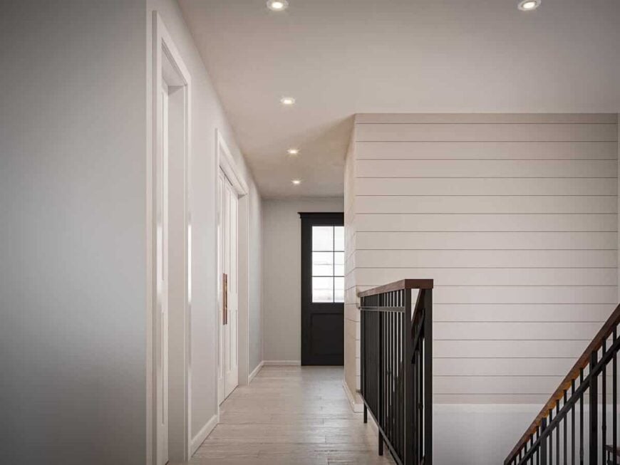 Down the entryway is a staircase leading to the basement.