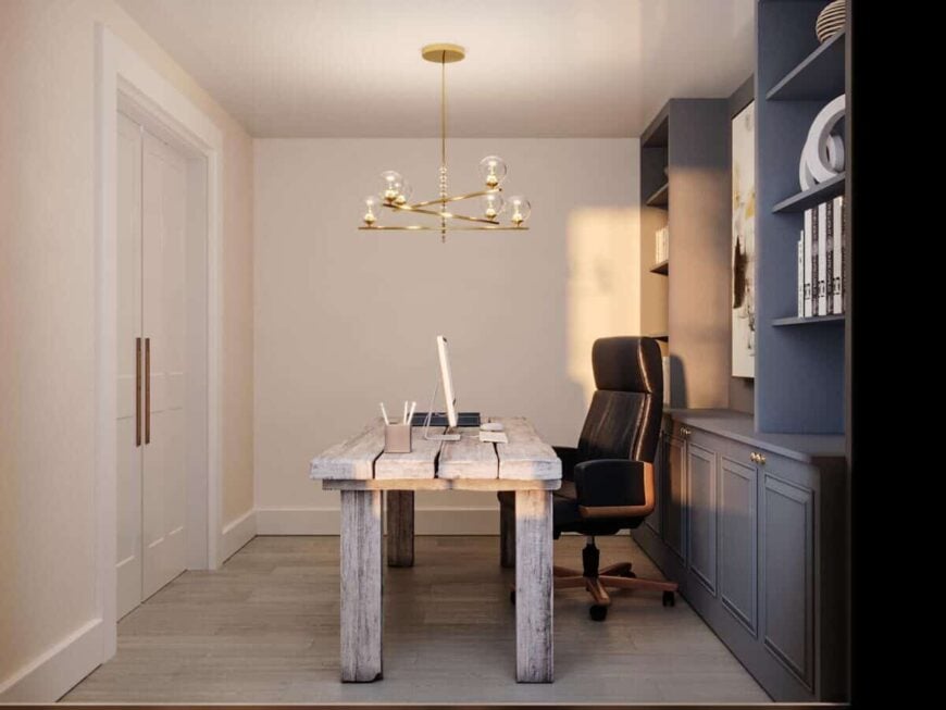 A contemporary brass chandelier illuminates the study.
