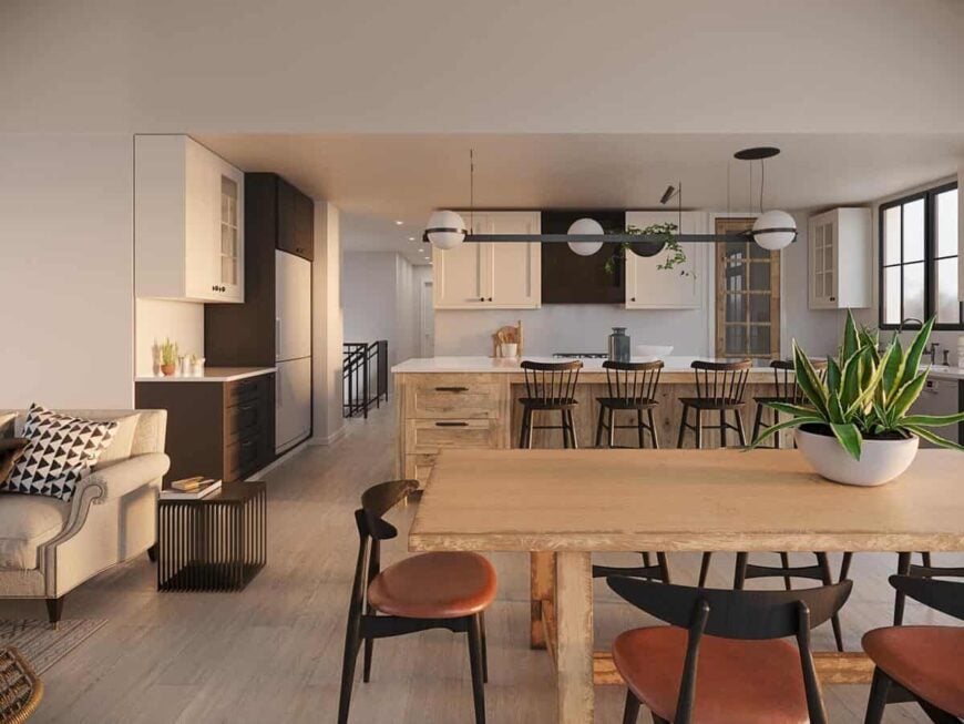 The centrally located dining area has a wooden dining table and modern round-back chairs.