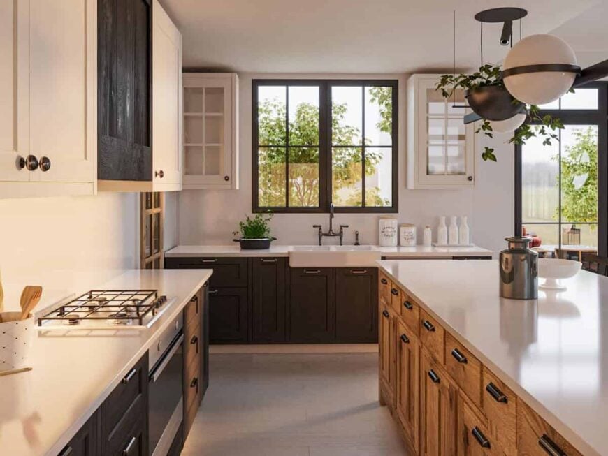 The kitchen is equipped with a built-in cooktop, a large island, and a farmhouse sink with views of the backyard.