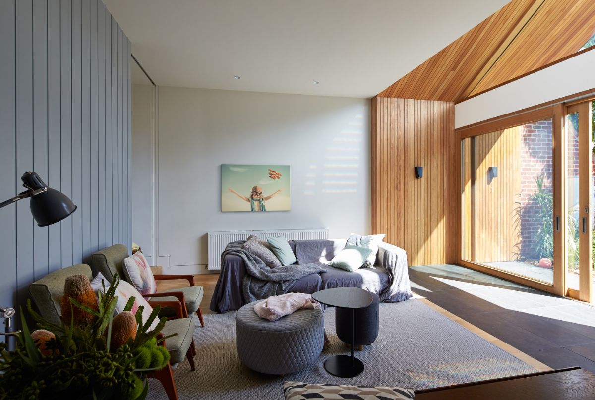 The downstairs living room highlighted a big sliding glass windows.