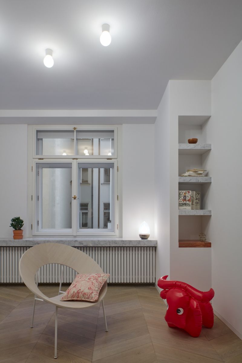 The kids paly room with large window and built-in cabinets.