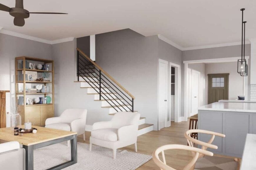 An open layout view of the kitchen, dining area, and den under a regular ceiling.