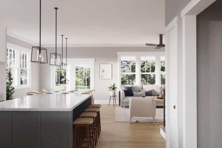 Four wooden bar stools complement the kitchen island.
