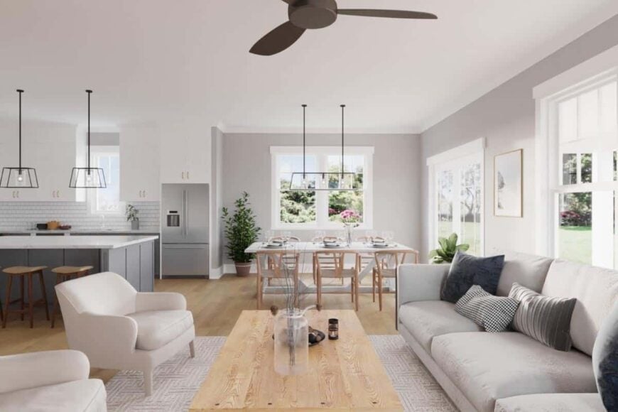 Across the den is the dining area furnished with a rectangular dining table and wooden chairs.