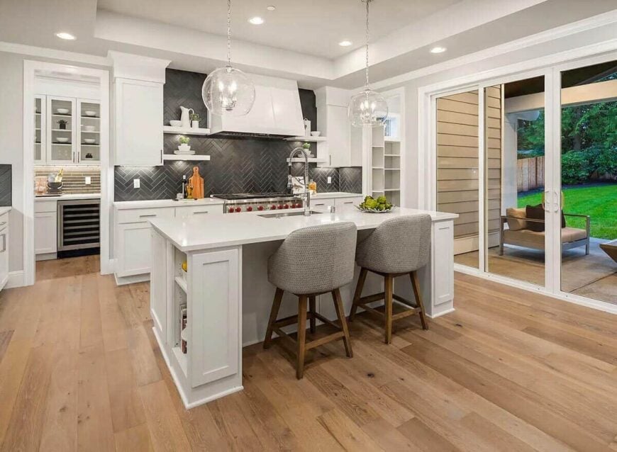 Sliding glass doors extend the kitchen onto a covered porch.