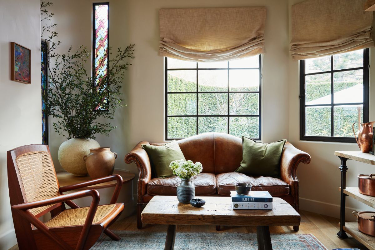 The formal living room with big windows looking out onto the garden. Image courtesy of Toptenrealestatedeals.com