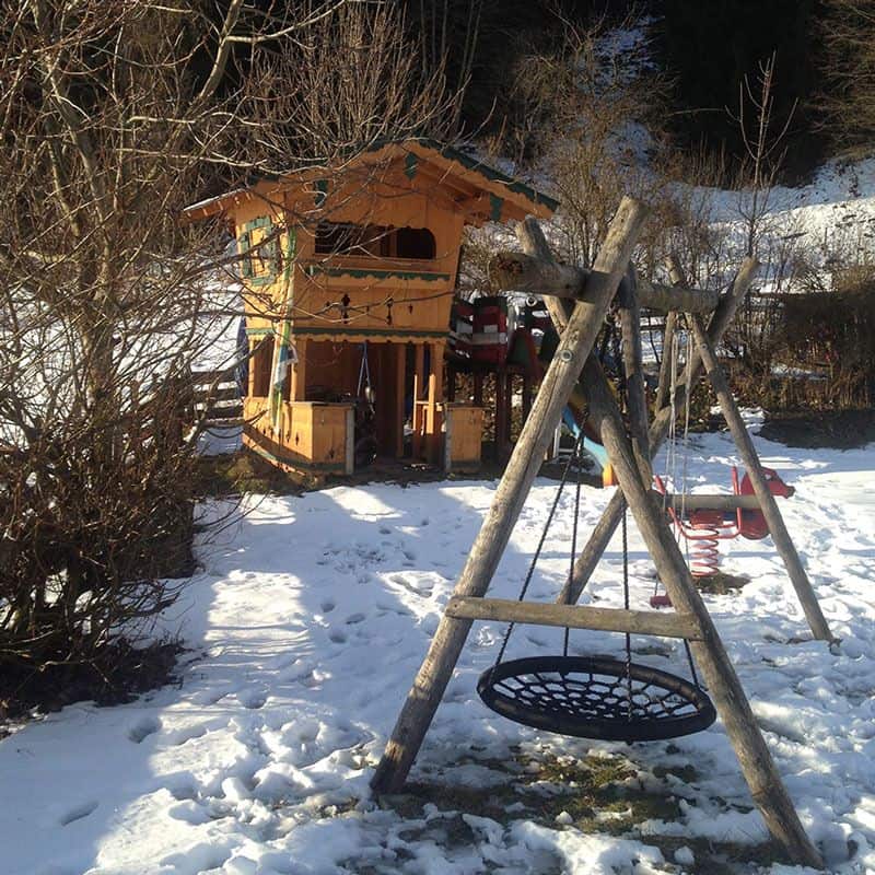 The lookout playhouse is also complemented with a wooden swing.
