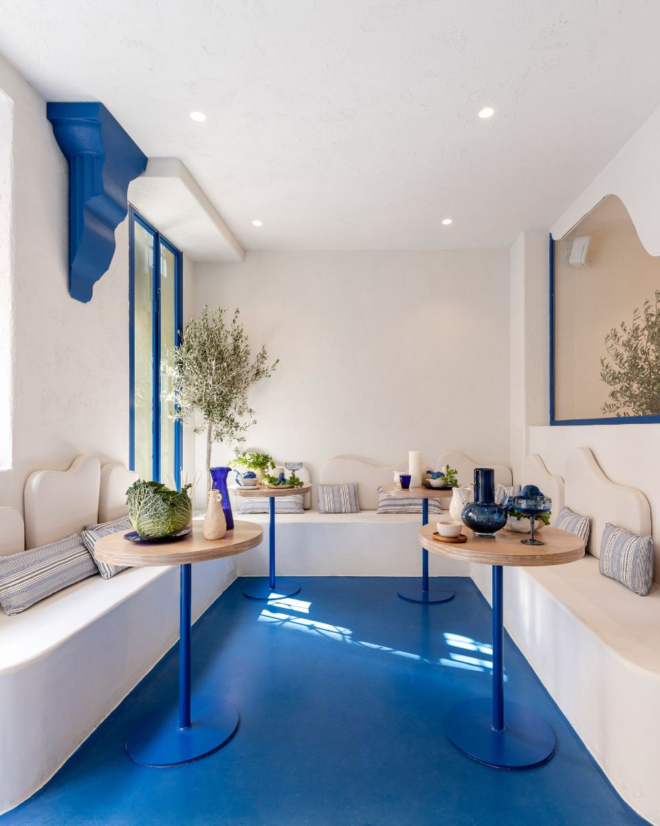 A privately enclosed dining area that features a blue flooring.
