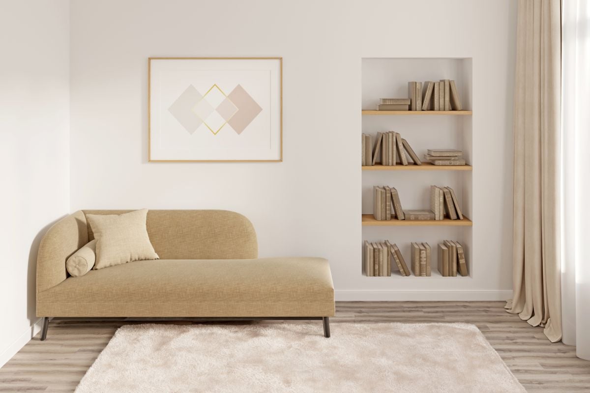 A small room with daybed and carpet.