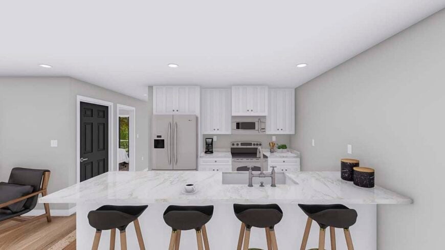 The kitchen includes slate appliances and a marble-top island fitted with an undermount sink.