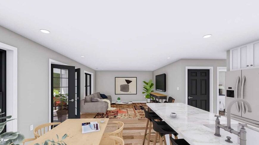 An open layout view of the kitchen, dining area, and living room under a white regular ceiling.