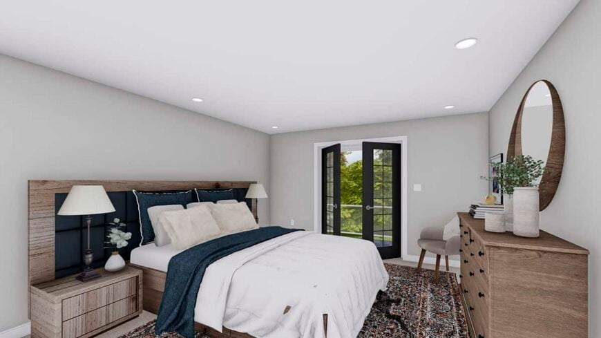 The primary bedroom features a custom bed, a wooden dresser, and deck access through a glazed door.