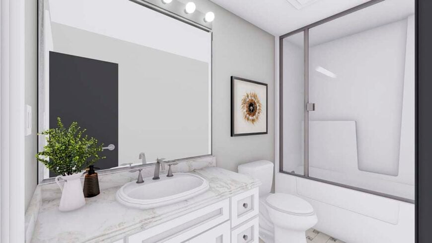 The bathroom is equipped with a single-sink vanity, a toilet, and a tub and shower combo enclosed in sliding glass doors.