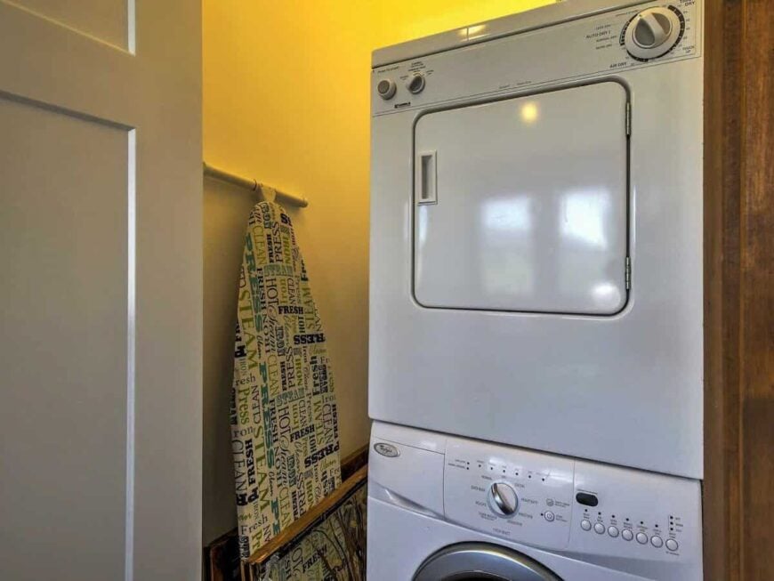 Laundry closet with stacked washer and dryer.