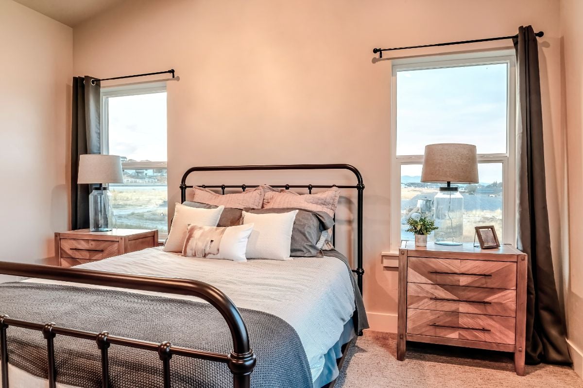 Double-Hung Windows and a bed in a room.