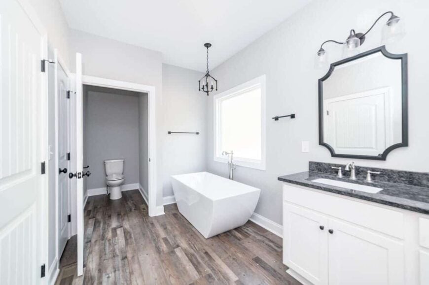 A white door on the side reveals the toilet room.