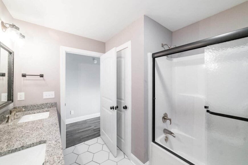 There's also a tub and shower combo fitted with chrome fixtures.