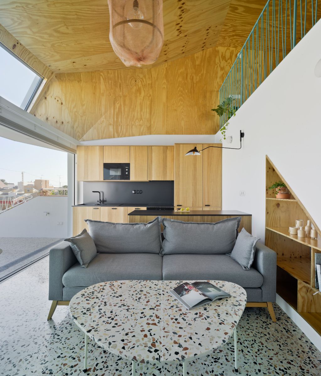 The living area of the house second floor and a view of the beach houses.