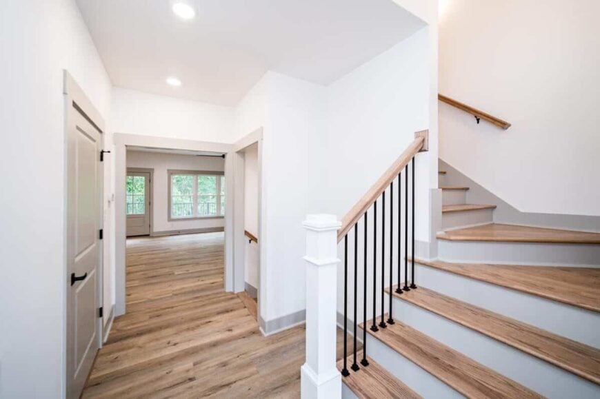 Staircase off the entry hall leading to the upstairs bedrooms.