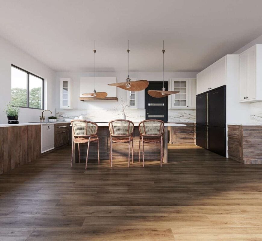A combination of white and wooden cabinets along with black appliances adds interest to the kitchen.