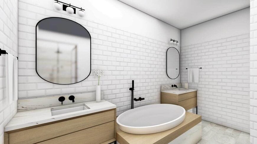 The primary bathroom features a deep soaking tub flanked by his and her sink vanities.