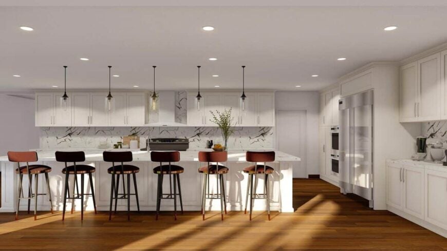 Six round bar stools and glass pendants line the kitchen island.