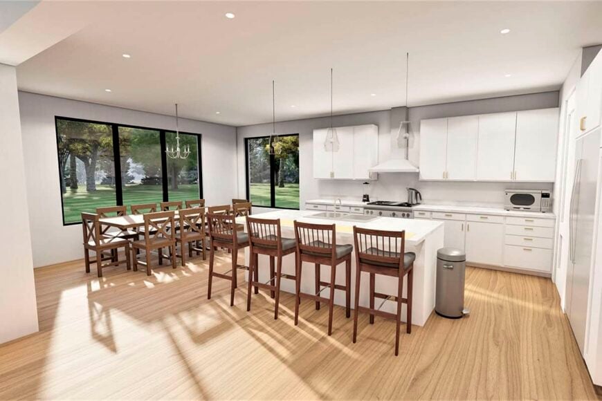 Eat-in kitchen with white cabinetry, a breakfast island, and a 10-seater dining set.