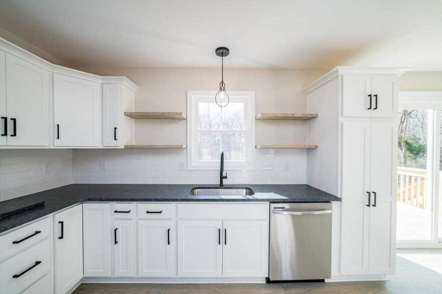 A window above the sink provides the kitchen with rearward views and natural light.